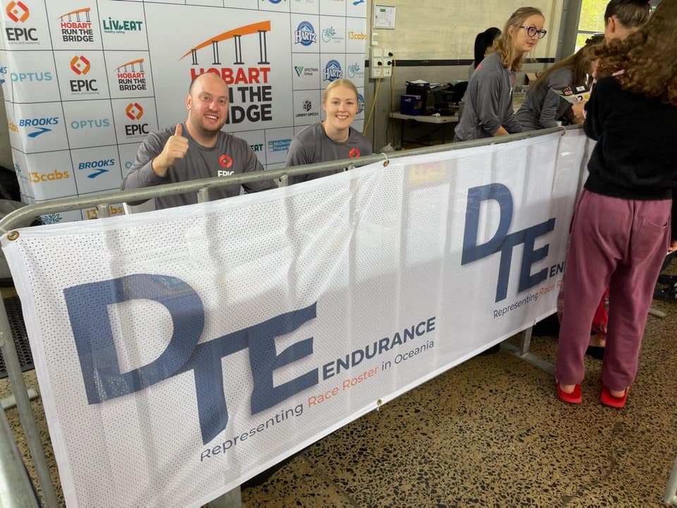 Executives Showing Thumb At Registration Booth